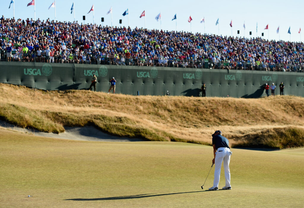 Jordan Spieth putts on the 18th green during the final round of the US Open at Chambers Bay