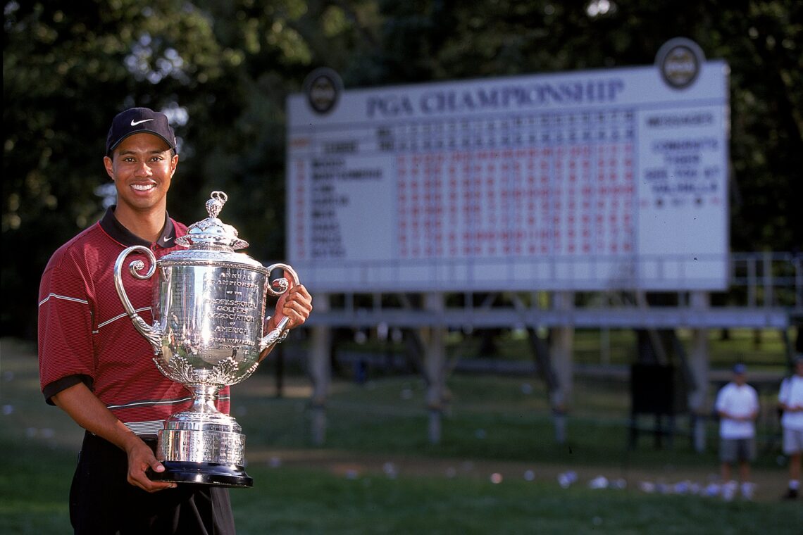 15 Aug 1999: Tiger Woods poses with his trophy after winning the PGA Championships at the Medinah Country Club in Medinah, Illinois. Mandatory Cred...