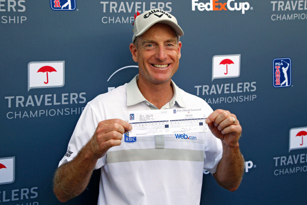 Jim Furyk poses with his scorecard after shooting a record setting 58 during the final round of the 2016 Travelers Championship at TCP River Highlands