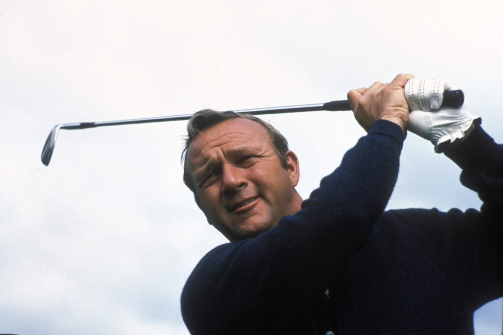 Arnold Palmer hits a shot